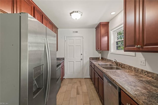 102 Basswood Dr, Newport News, VA 23601 - kitchen with stainless steel appliances, a sink, dark countertops, and recessed lighting