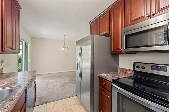 102 Basswood Dr, Newport News, VA 23601 - kitchen with appliances with stainless steel finishes, dark countertops, a sink, light carpet, and pendant lighting