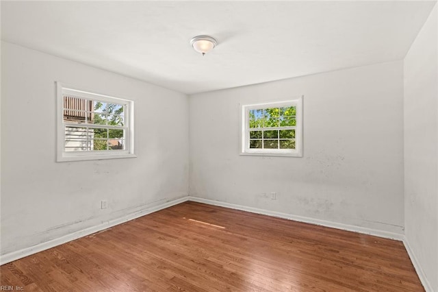 102 Basswood Dr, Newport News, VA 23601 - spare room featuring plenty of natural light, wood finished floors, and baseboards