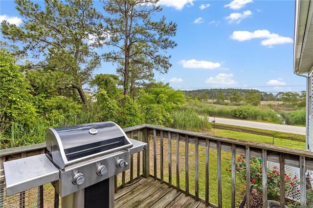 150 Ridge Rd, Poquoson, VA 23662 - wooden deck featuring a grill and a lawn