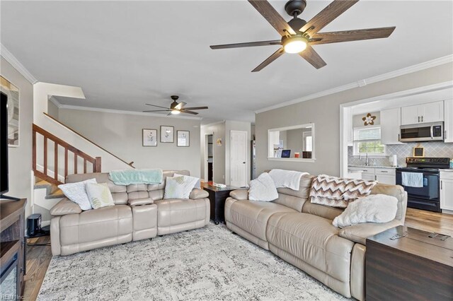 150 Ridge Rd, Poquoson, VA 23662 - living area with a ceiling fan, stairs, wood finished floors, and crown molding