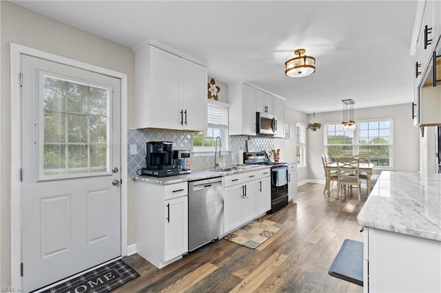 150 Ridge Rd, Poquoson, VA 23662 - kitchen featuring appliances with stainless steel finishes, a sink, dark wood-style floors, and white cabinets