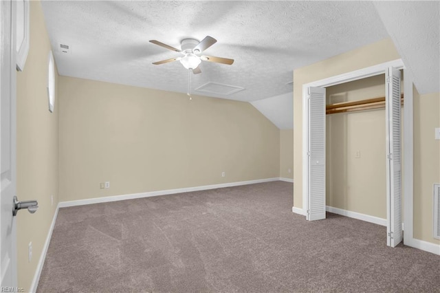 242 Genoa Dr Unit 20, Hampton, VA 23664 - unfurnished bedroom with carpet flooring, a textured ceiling, a closet, a ceiling fan, and vaulted ceiling