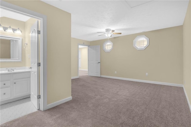 242 Genoa Dr Unit 20, Hampton, VA 23664 - empty room with light carpet, ceiling fan, baseboards, and a sink
