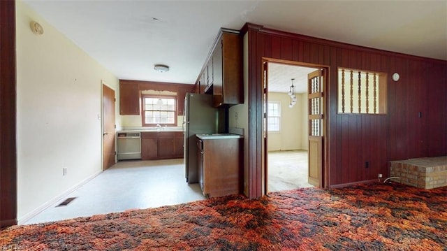 1030 Mary Peake Blvd, Hampton, VA 23666 - kitchen featuring stainless steel appliances, baseboards, wooden walls, and a sink