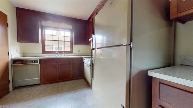 1030 Mary Peake Blvd, Hampton, VA 23666 - kitchen featuring dishwasher, freestanding refrigerator, a sink, and light countertops