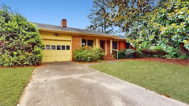 1030 Mary Peake Blvd, Hampton, VA 23666 - ranch-style home with a front lawn, an attached garage, driveway, and a chimney