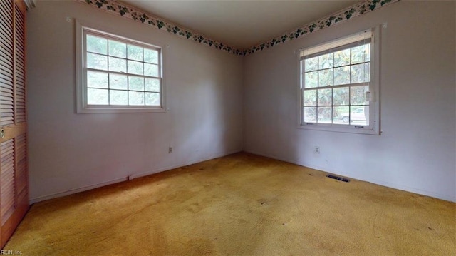 1030 Mary Peake Blvd, Hampton, VA 23666 - spare room featuring healthy amount of natural light, light colored carpet, and baseboards