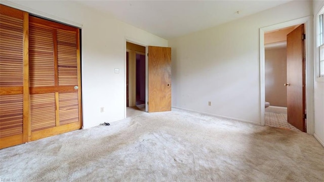 1030 Mary Peake Blvd, Hampton, VA 23666 - unfurnished bedroom featuring a closet, carpet flooring, and connected bathroom