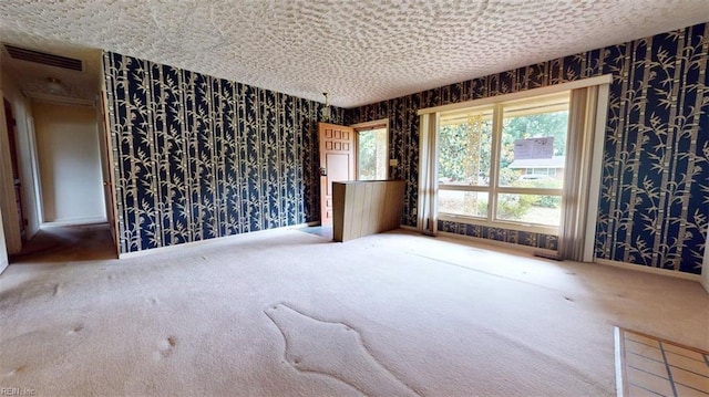 1030 Mary Peake Blvd, Hampton, VA 23666 - spare room featuring wallpapered walls, carpet flooring, and baseboards