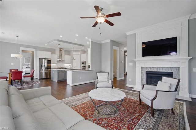 2244 Rio Rancho Dr, Virginia Beach, VA 23456 - living room with ceiling fan, dark wood-style floors, recessed lighting, ornamental molding, and a high end fireplace
