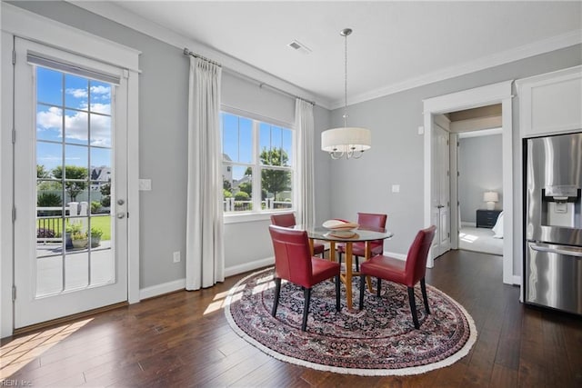 2244 Rio Rancho Dr, Virginia Beach, VA 23456 - dining area with dark wood-type flooring, plenty of natural light, baseboards, a chandelier, and crown molding