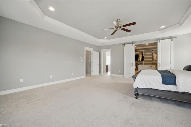 2244 Rio Rancho Dr, Virginia Beach, VA 23456 - bedroom with a raised ceiling, recessed lighting, a barn door, baseboards, and a spacious closet