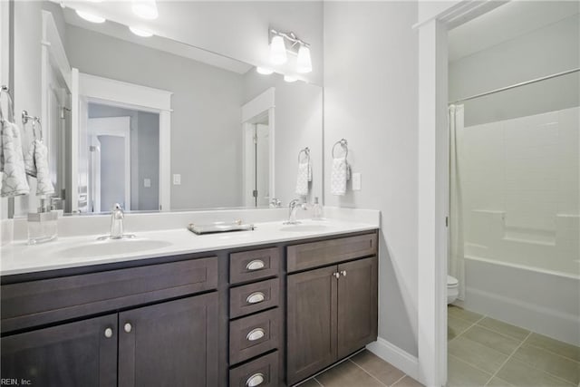 2244 Rio Rancho Dr, Virginia Beach, VA 23456 - bathroom featuring double vanity, toilet, tile patterned flooring, shower / tub combo, and baseboards