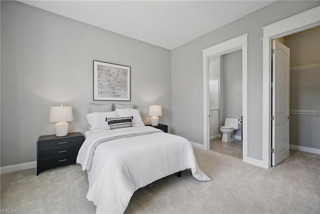 2244 Rio Rancho Dr, Virginia Beach, VA 23456 - bedroom featuring carpet, a walk in closet, a closet, and baseboards