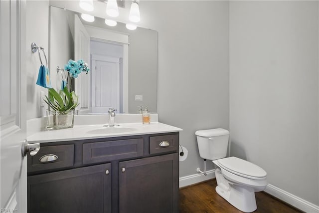 2244 Rio Rancho Dr, Virginia Beach, VA 23456 - bathroom featuring toilet, vanity, baseboards, and wood finished floors