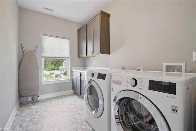 2244 Rio Rancho Dr, Virginia Beach, VA 23456 - laundry area featuring cabinet space, washer and dryer, and baseboards