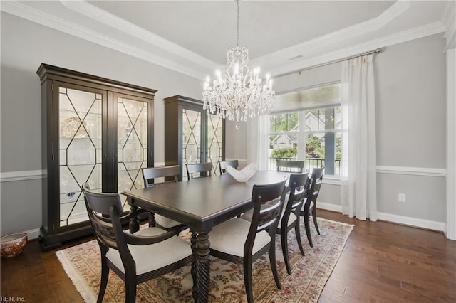 2244 Rio Rancho Dr, Virginia Beach, VA 23456 - dining room featuring a chandelier, dark wood finished floors, crown molding, baseboards, and a raised ceiling