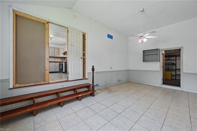 3813 Honeytree Ln, Virginia Beach, VA 23452 - tiled empty room with a ceiling fan, lofted ceiling, and wainscoting