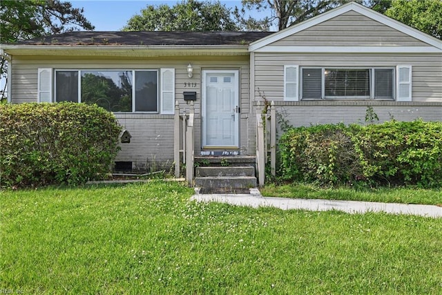 3813 Honeytree Ln, Virginia Beach, VA 23452 - view of front facade featuring brick siding and a front yard
