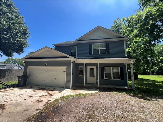 405 San Antonio Blvd, Norfolk, VA 23505 - view of front facade featuring covered porch, fence, a garage, and concrete driveway