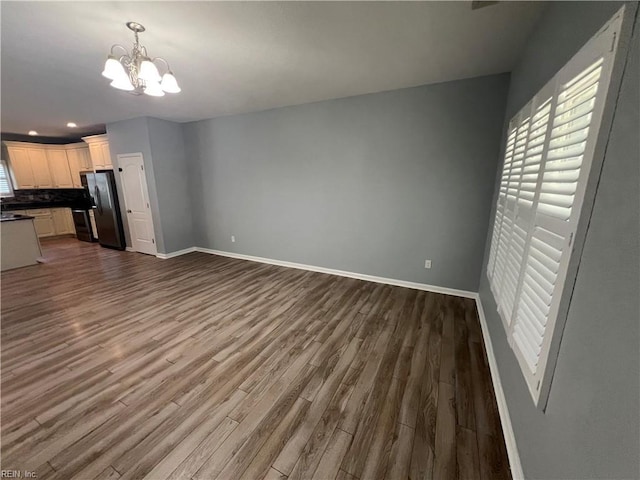 405 San Antonio Blvd, Norfolk, VA 23505 - unfurnished living room featuring a chandelier, dark wood-type flooring, baseboards, and recessed lighting
