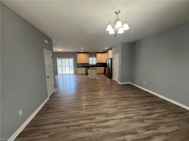 405 San Antonio Blvd, Norfolk, VA 23505 - unfurnished living room with a chandelier, dark wood-style flooring, baseboards, and recessed lighting