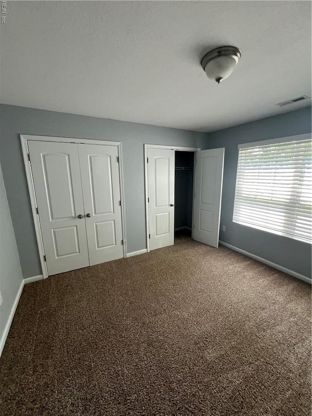 405 San Antonio Blvd, Norfolk, VA 23505 - unfurnished bedroom featuring two closets, carpet flooring, and baseboards