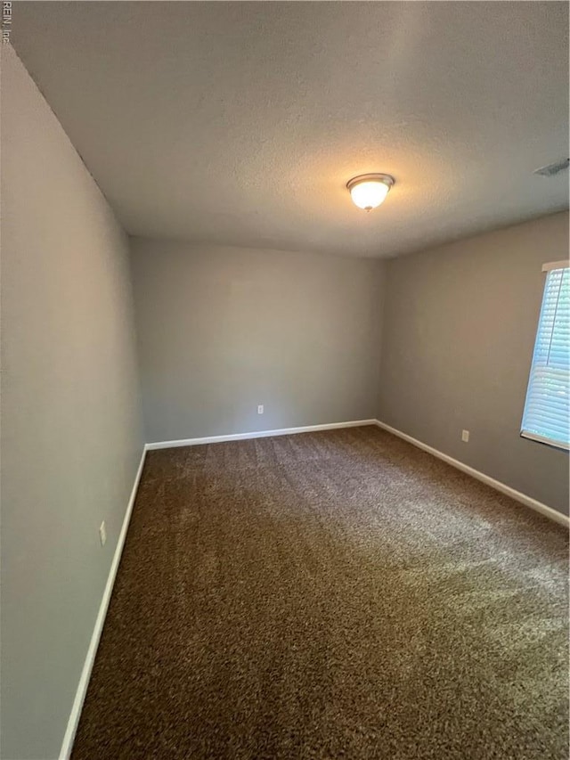 405 San Antonio Blvd, Norfolk, VA 23505 - carpeted empty room with baseboards and a textured ceiling