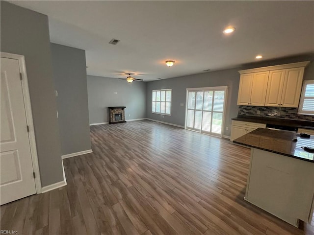 405 San Antonio Blvd, Norfolk, VA 23505 - kitchen with a ceiling fan, dark countertops, baseboards, wood finished floors, and decorative backsplash
