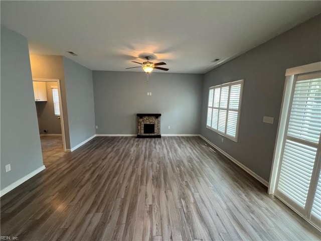 405 San Antonio Blvd, Norfolk, VA 23505 - unfurnished living room featuring ceiling fan, dark wood-style flooring, and baseboards