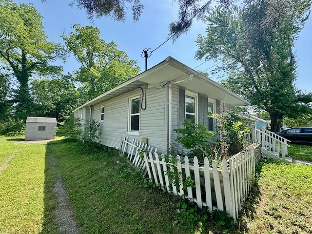 54 W Virginia Ave, Hampton, VA 23663 - view of property exterior with a storage unit and an outbuilding