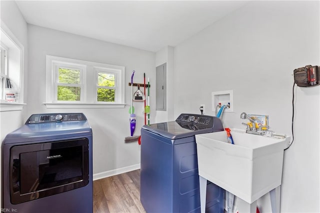 6944 Crittenden Rd, Suffolk, VA 23432 - laundry room with washing machine and clothes dryer, electric panel, wood finished floors, and baseboards