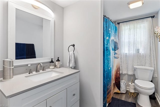 6944 Crittenden Rd, Suffolk, VA 23432 - bathroom featuring vanity, toilet, wood finished floors, and a shower with curtain