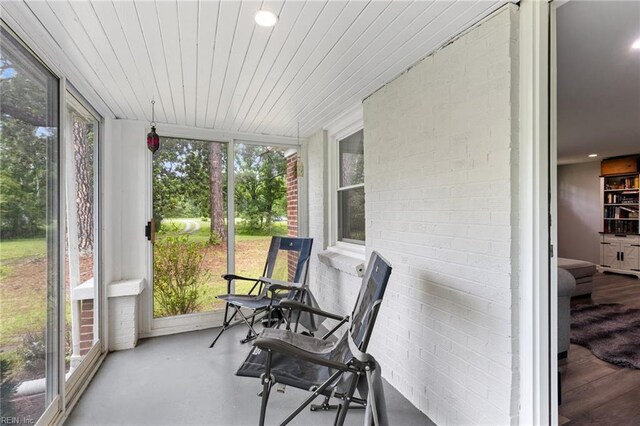 6944 Crittenden Rd, Suffolk, VA 23432 - sunroom / solarium with concrete floors and brick wall