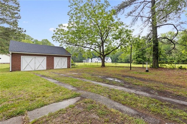 6944 Crittenden Rd, Suffolk, VA 23432 - view of yard with a barn, an outbuilding, and a garage