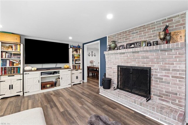 6944 Crittenden Rd, Suffolk, VA 23432 - living room with a fireplace, dark wood-type flooring, built in features, and recessed lighting