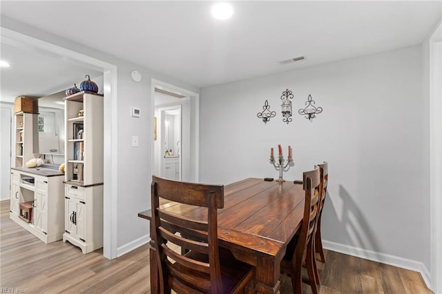 6944 Crittenden Rd, Suffolk, VA 23432 - dining area featuring light wood-style floors, baseboards, and recessed lighting