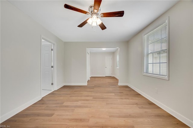 302 Artis St, Franklin, VA 23851 - unfurnished room with baseboards, ceiling fan, and light wood-style floors