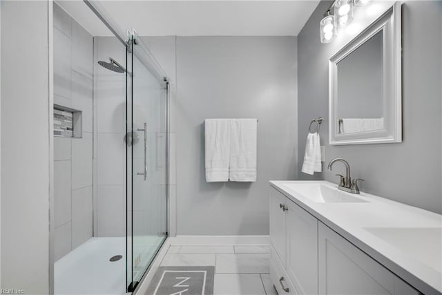 302 Artis St, Franklin, VA 23851 - full bathroom featuring marble finish floors, baseboards, a stall shower, and double vanity