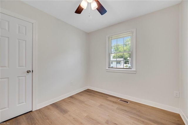 302 Artis St, Franklin, VA 23851 - spare room featuring light wood finished floors, baseboards, and a ceiling fan