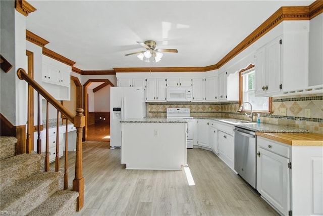 1121 Vineyard Dr, Chesapeake, VA 23322 - kitchen with white appliances, a sink, a ceiling fan, light wood-style flooring, and white cabinetry