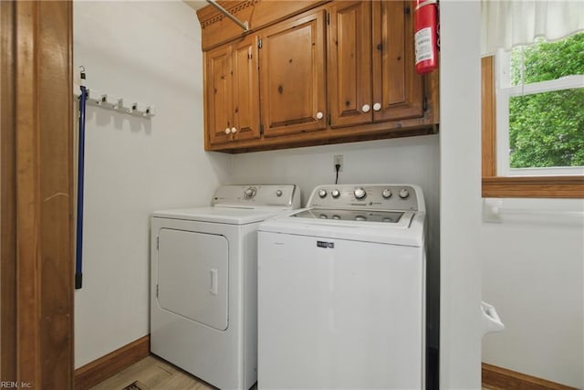 1121 Vineyard Dr, Chesapeake, VA 23322 - clothes washing area with cabinet space, washing machine and clothes dryer, and baseboards