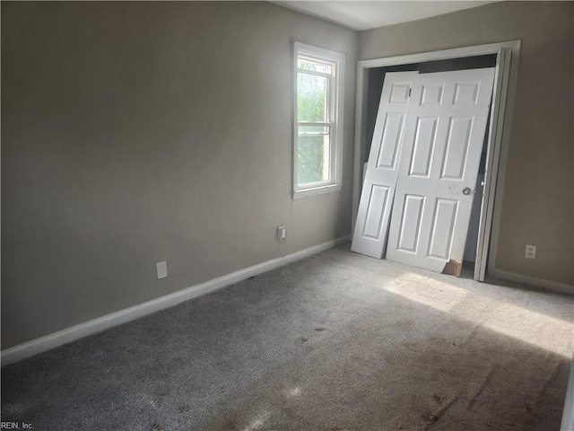 106 Clyde St, Hampton, VA 23669 - unfurnished bedroom with carpet, baseboards, and a closet