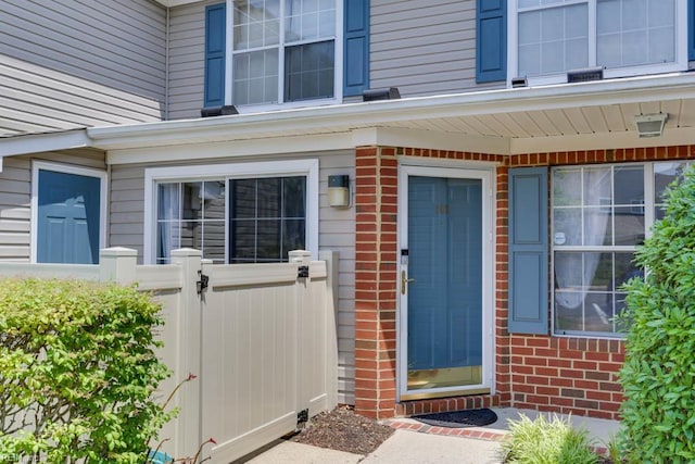 3857 Lasalle Dr Unit 102, Virginia Beach, VA 23453 - doorway to property featuring a gate, fence, and brick siding