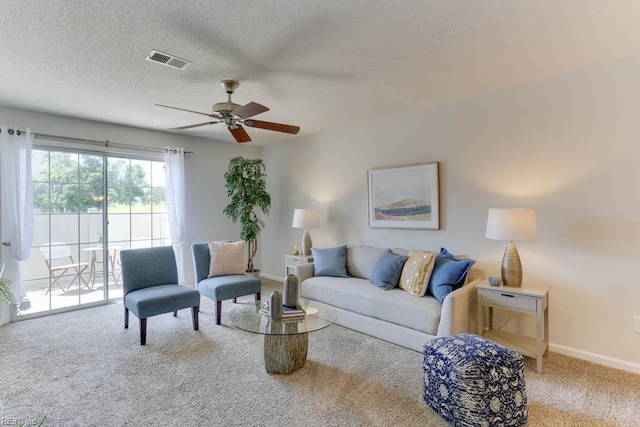 3857 Lasalle Dr Unit 102, Virginia Beach, VA 23453 - carpeted living area with ceiling fan, a textured ceiling, and baseboards