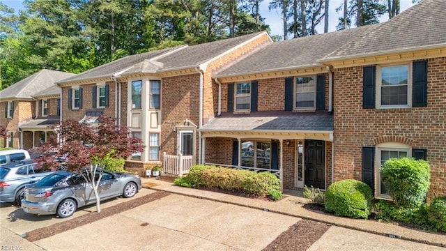 1217 Peoples Way, Virginia Beach, VA 23451 - view of property with a shingled roof and brick siding