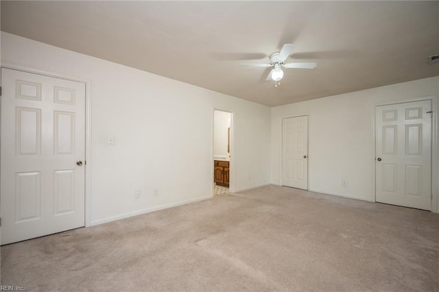 1217 Peoples Way, Virginia Beach, VA 23451 - unfurnished bedroom with light colored carpet, baseboards, connected bathroom, and ceiling fan