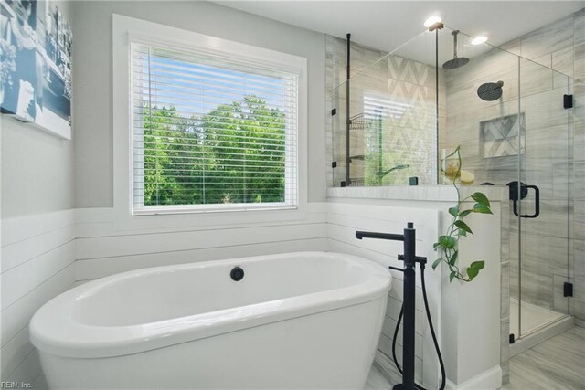 1028 Egret Ln, Suffolk, VA 23434 - full bath featuring a shower stall, plenty of natural light, and a freestanding tub