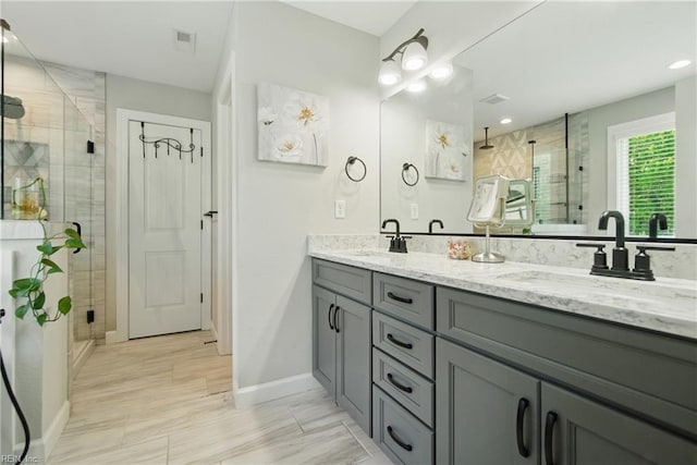 1028 Egret Ln, Suffolk, VA 23434 - full bathroom with a stall shower, double vanity, baseboards, and recessed lighting